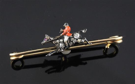 A late Victorian gold, enamel and diamond set bar brooch/stock pin modelled as a huntsman on his horse, 1.75in.